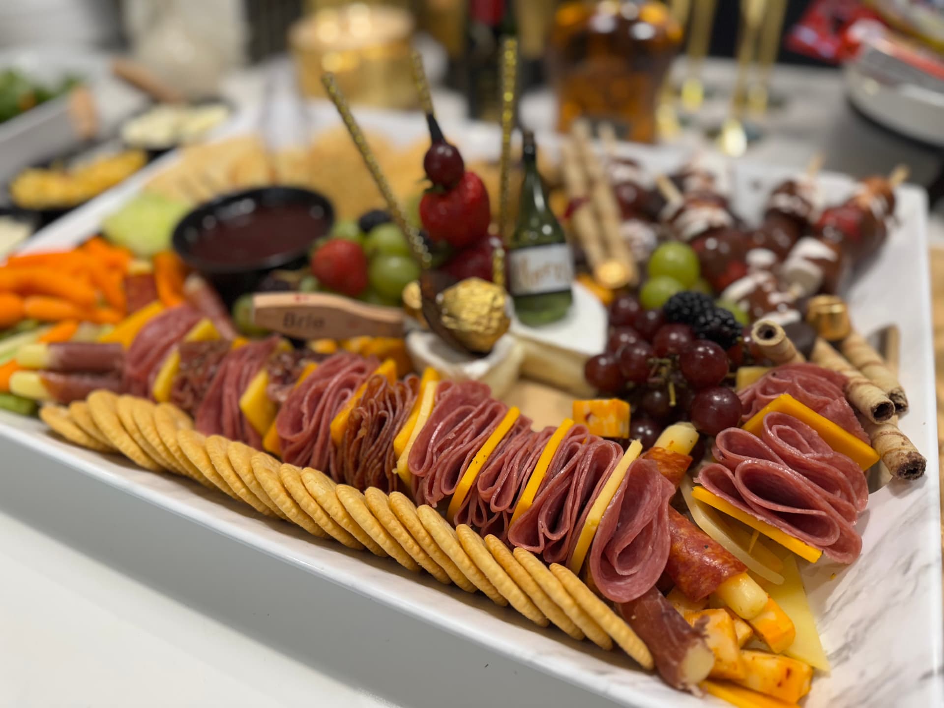 Charcuterie board with mini champagne
